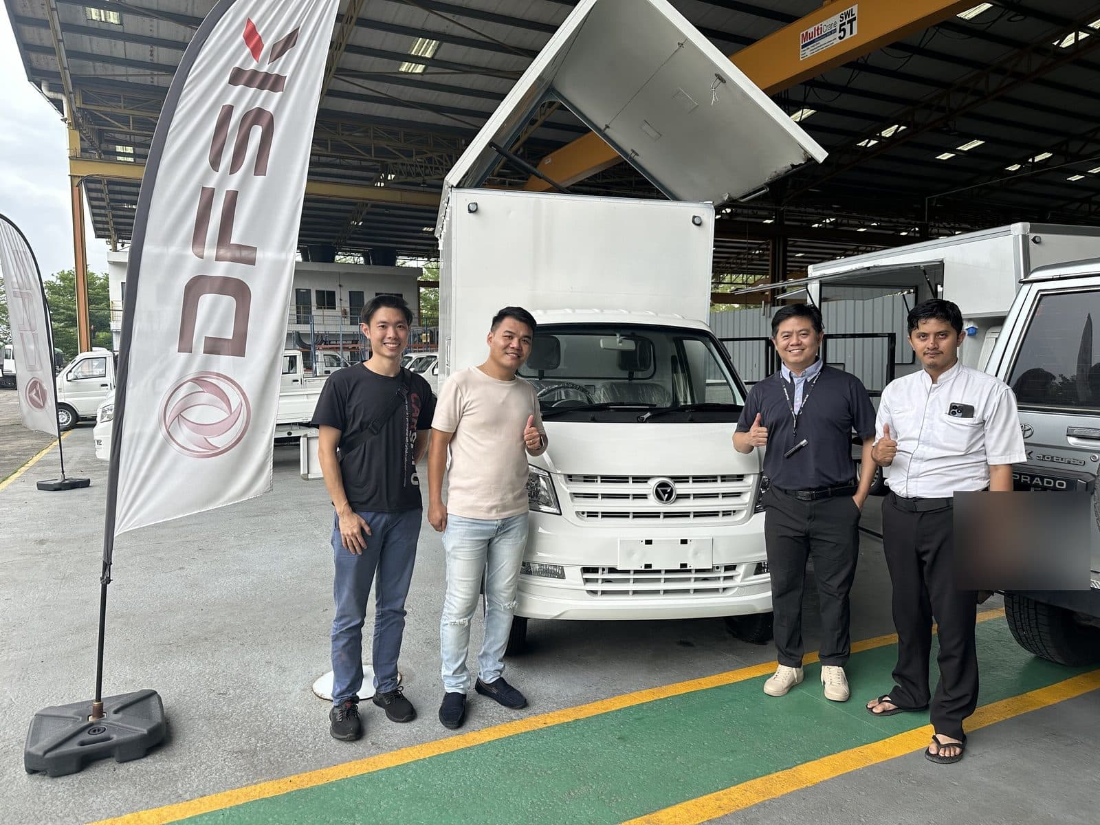 CarShifu team servicing a box-body lorry at the depot in KL